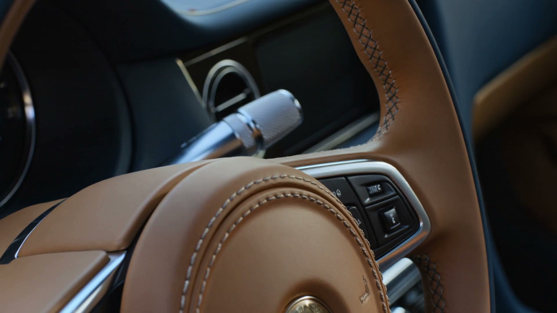 Saddle leather steering wheel and finely finished grand touring interior